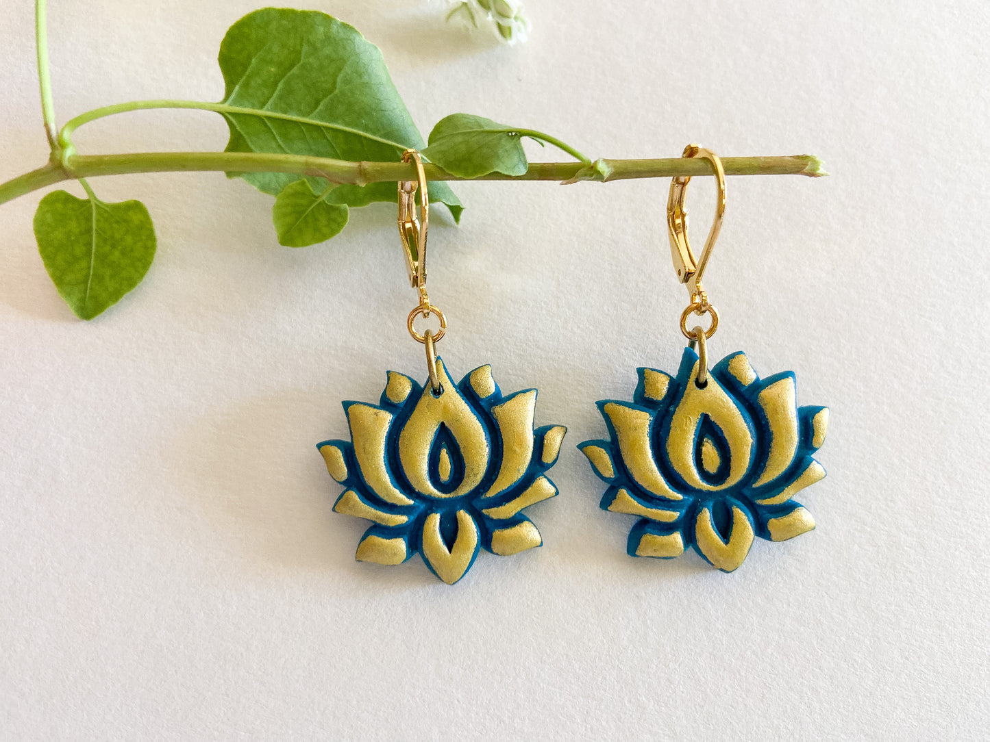 Emerald and gold lotus flower with 14k gold plated closed hook.